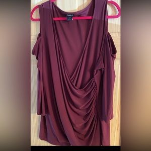 Selling a torrid top in a wine color wore just a few times size 3